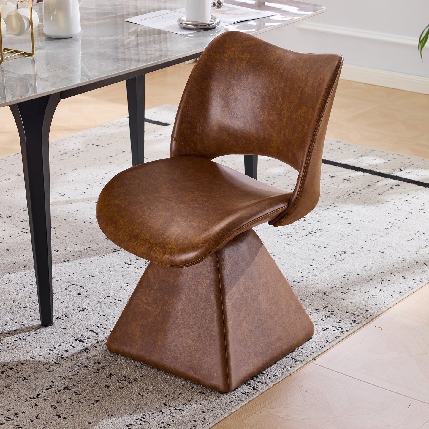 The swivel dining chair combines modern craftsmanship and can be combined in multiple sets. It is comfortable, artificial leather brown, and upholstered with modern high-back tables and chairs
