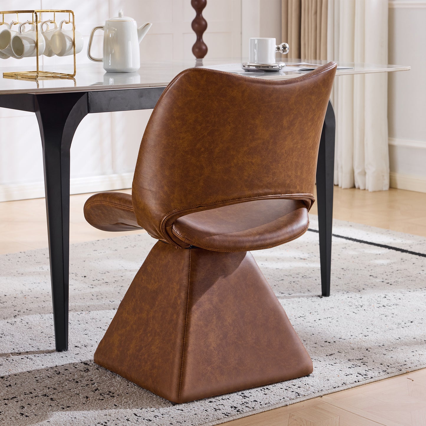 The swivel dining chair combines modern craftsmanship and can be combined in multiple sets. It is comfortable, artificial leather brown, and upholstered with modern high-back tables and chairs